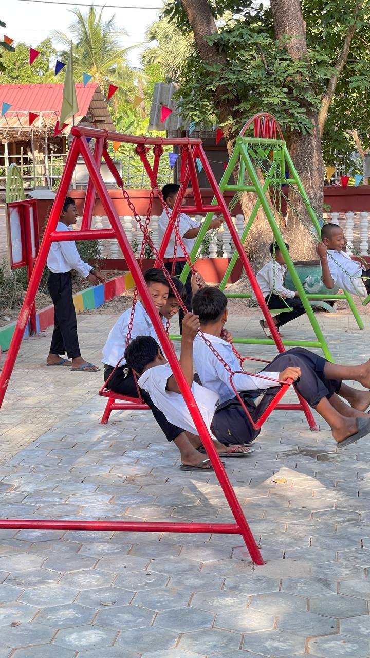 Repairing playground equipment at the school